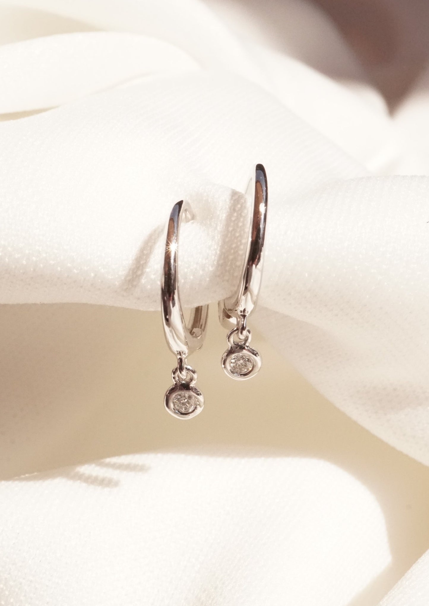 14k Dangling Bezel Diamond Huggies